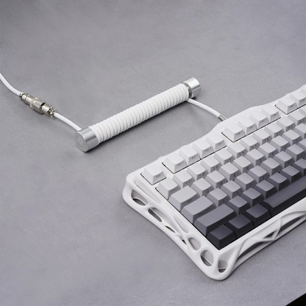 GravaStar Coiled Aviator USB Cable connected on a desk setup