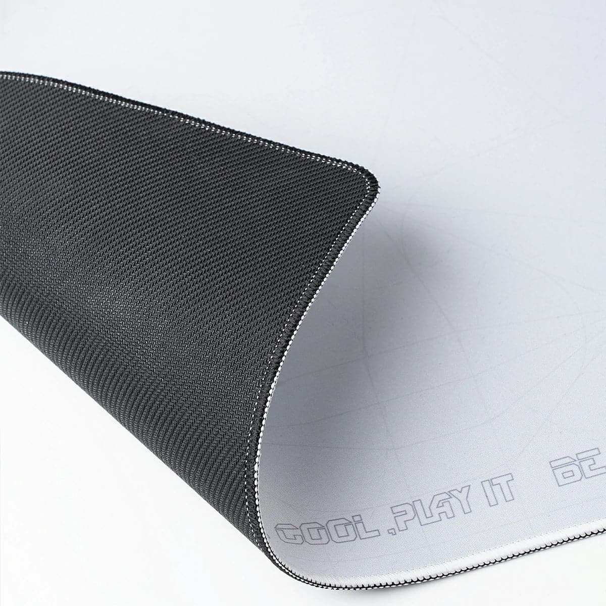 GravaStar Gaming Mouse Pad on a gaming desk setup with keyboard and mouse