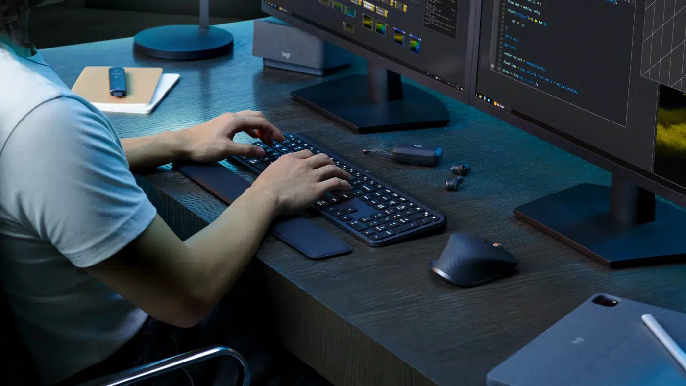 Typing on Logitech MX Keys S Graphite illuminated keyboard