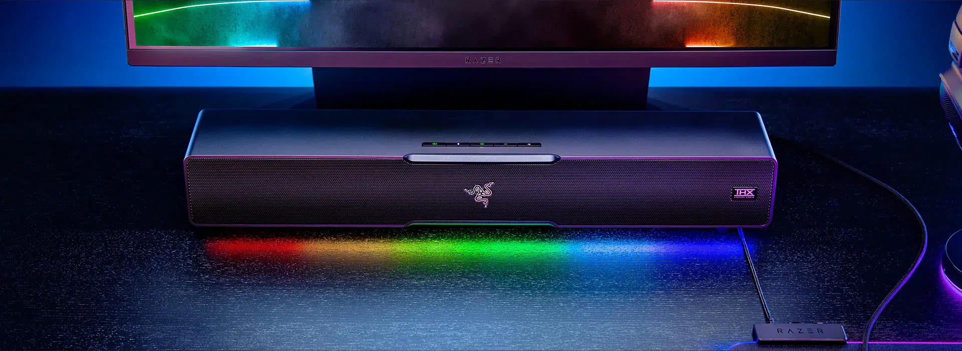 Razer Leviathan V2 soundbar beneath a monitor in a desktop setup